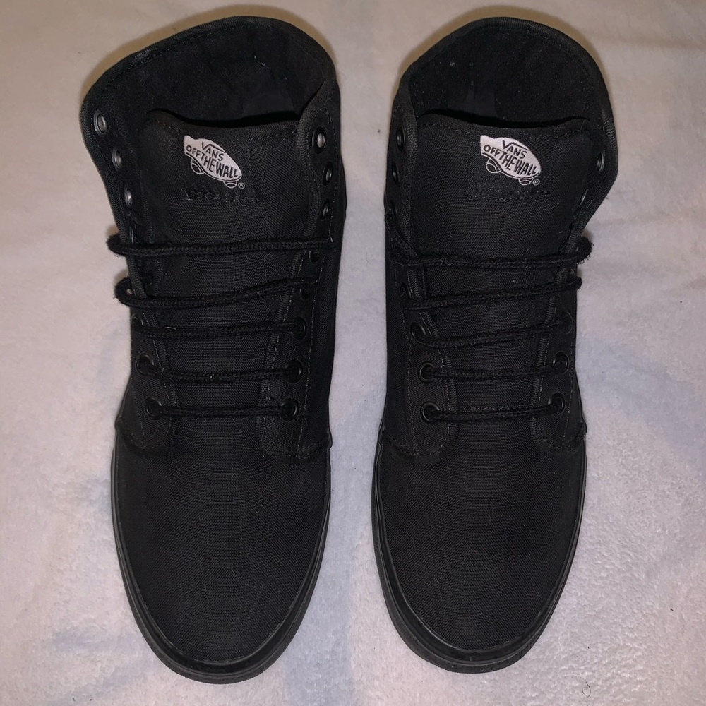 High-top sneakers by Vans